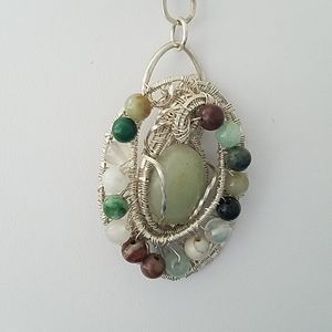 Wire Weaved Sterling Silver Pendant with pale jade